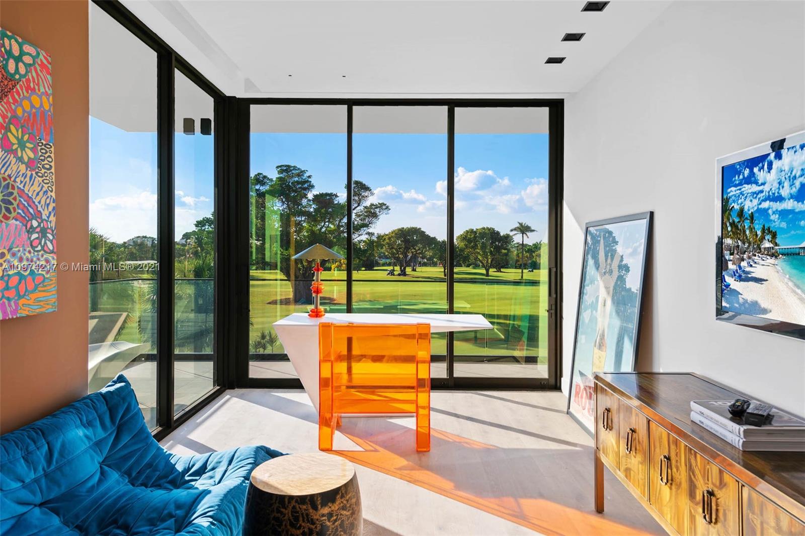 5470 La Gorce Drive Miami Beach, FL 33140 - Photo 50 of 71 a reading room with furniture and a floor to ceiling window