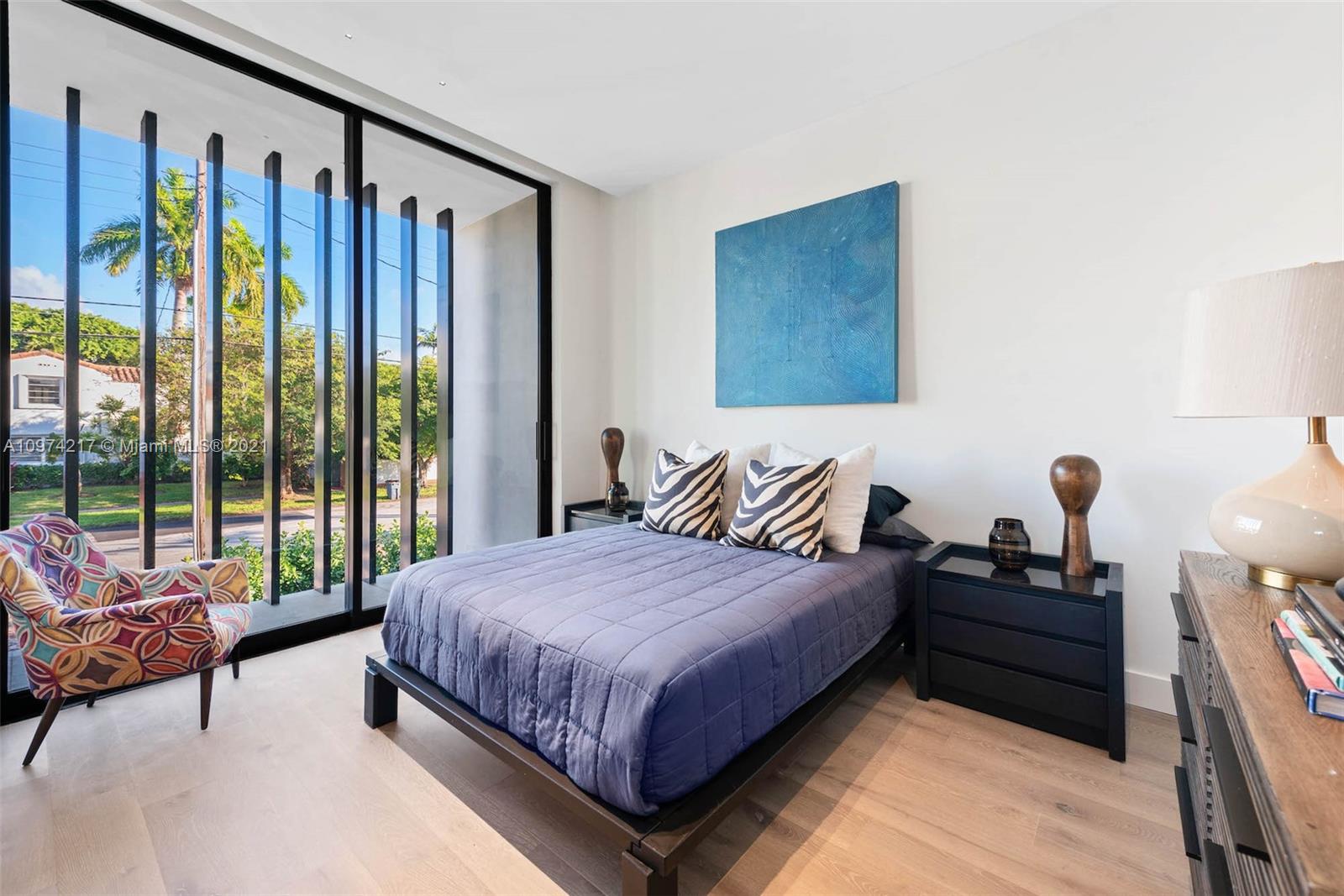 5470 La Gorce Drive Miami Beach, FL 33140 - Photo 55 of 71 a bedroom with a bed and a couch