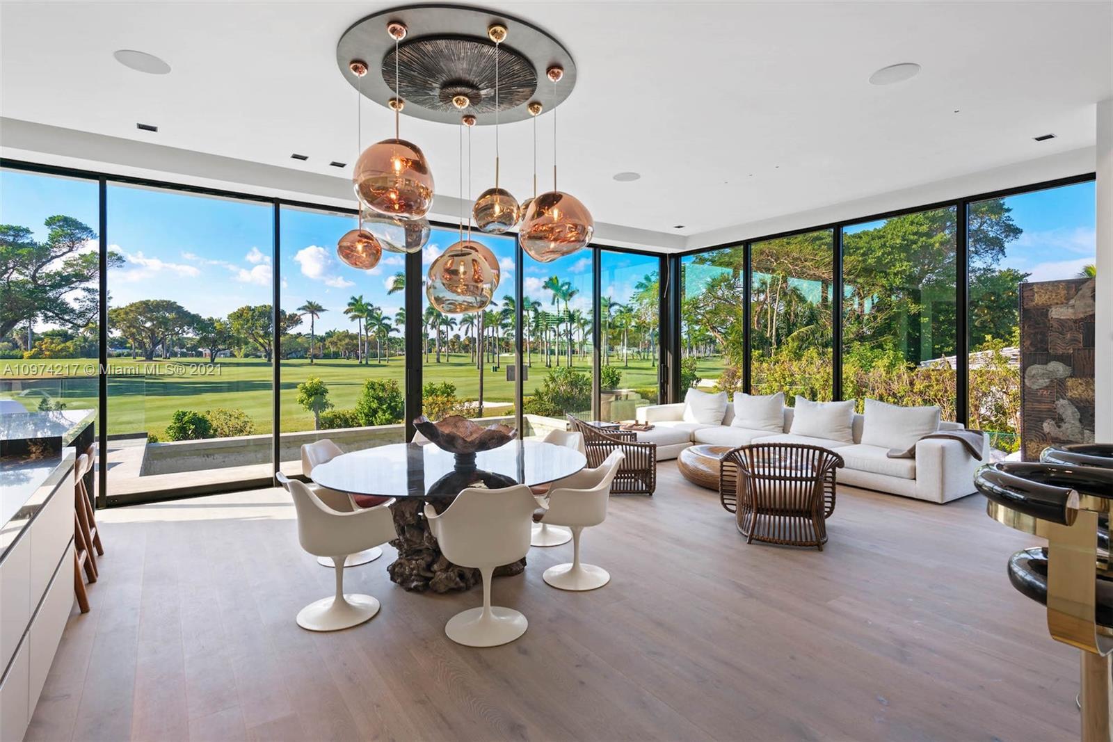 5470 La Gorce Drive Miami Beach, FL 33140 - Photo 6 of 71 a living room with furniture and a large window