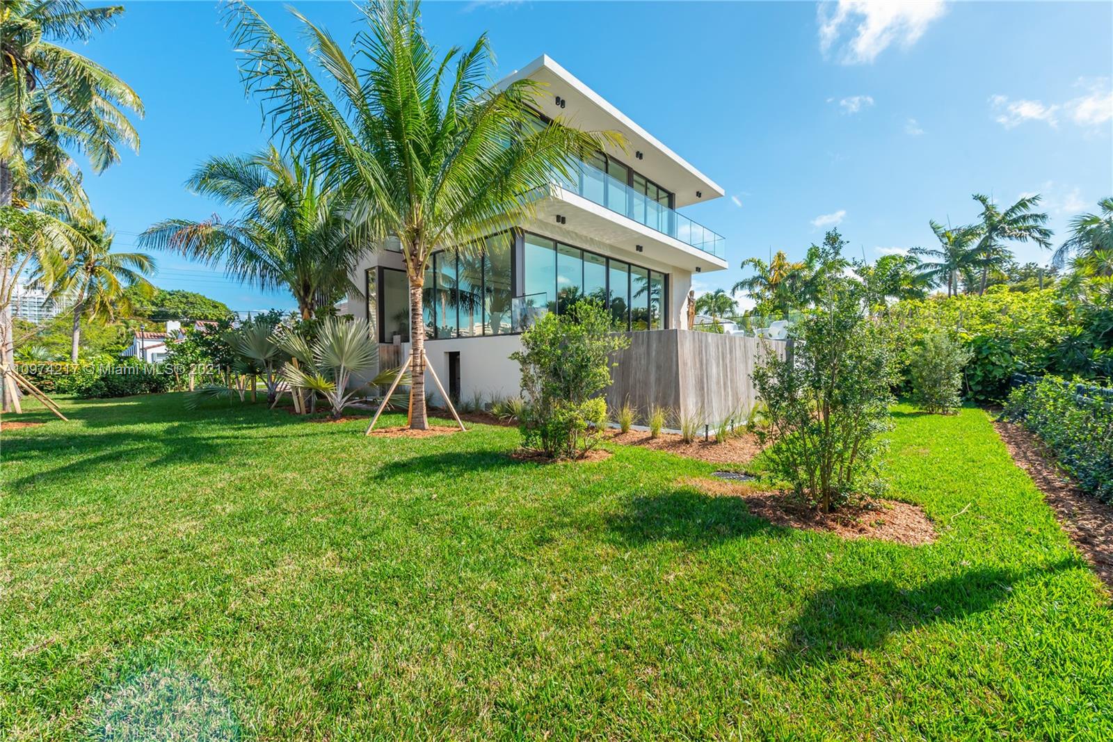 5470 La Gorce Drive Miami Beach, FL 33140 - Photo 63 of 71 a view of a house with a yard and a patio