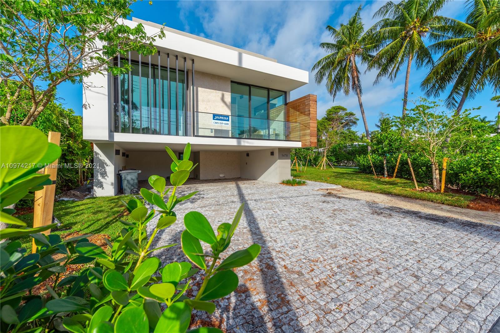 5470 La Gorce Drive Miami Beach, FL 33140 - Photo 65 of 71 a front view of a house with garden