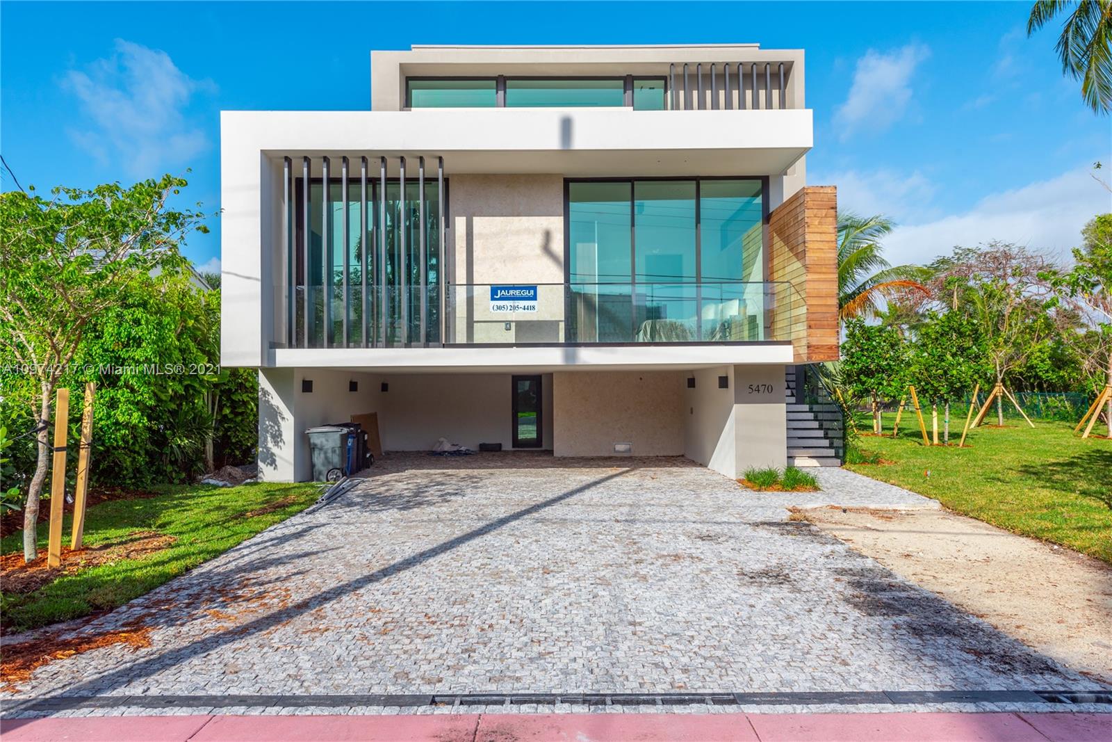 5470 La Gorce Drive Miami Beach, FL 33140 - Photo 66 of 71 a front view of a house with garden