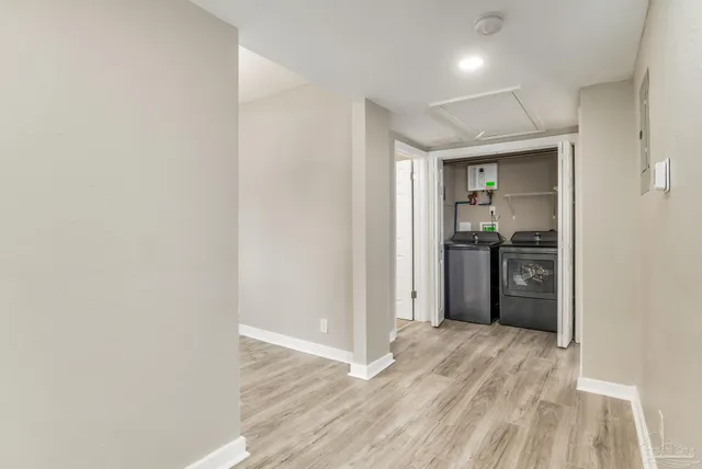 a view of a kitchen with a sink and a refrigerator