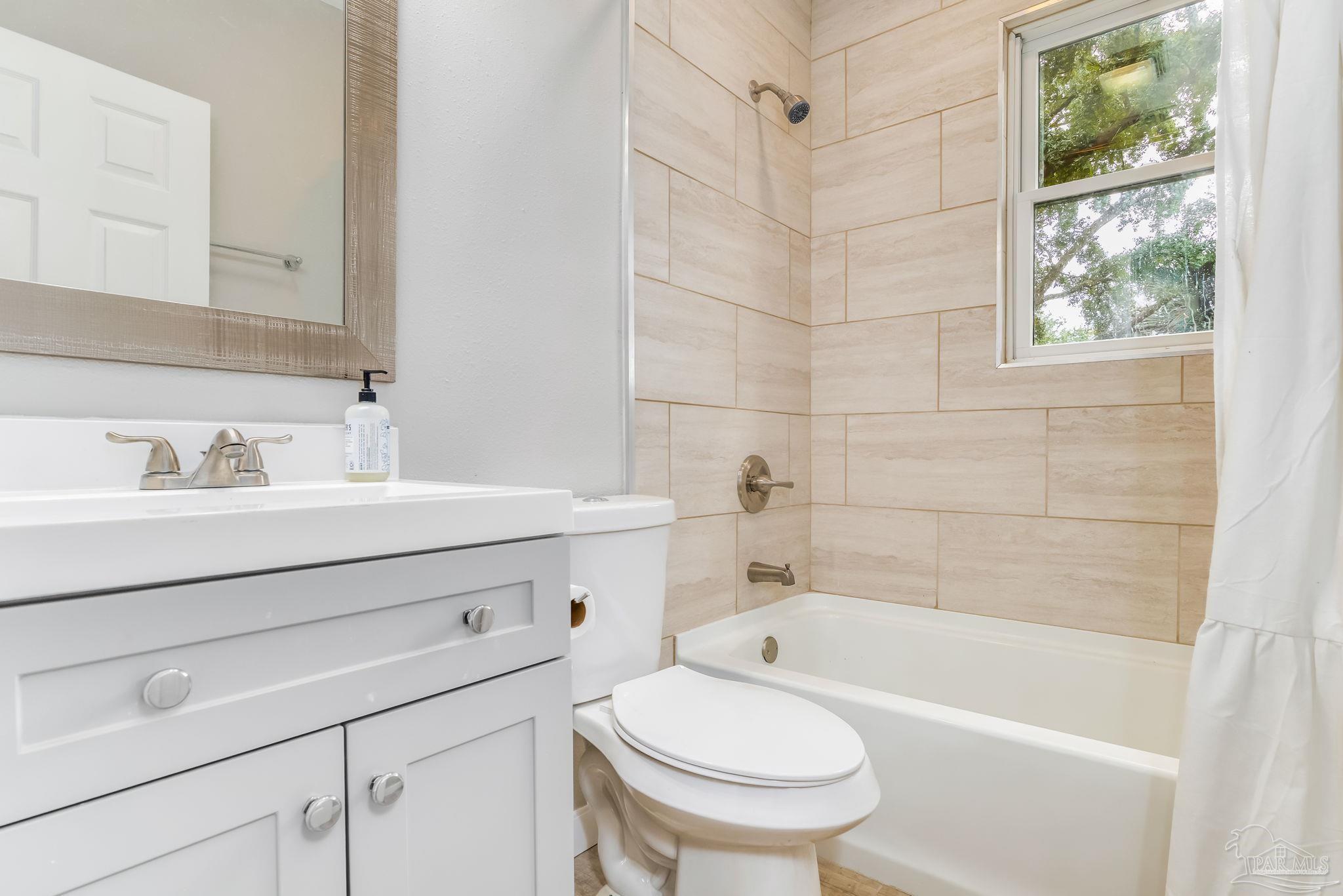 207 Bryant Road Pensacola, FL 32507 - Photo 20 of 23 a bathroom with a sink a toilet and a bathtub