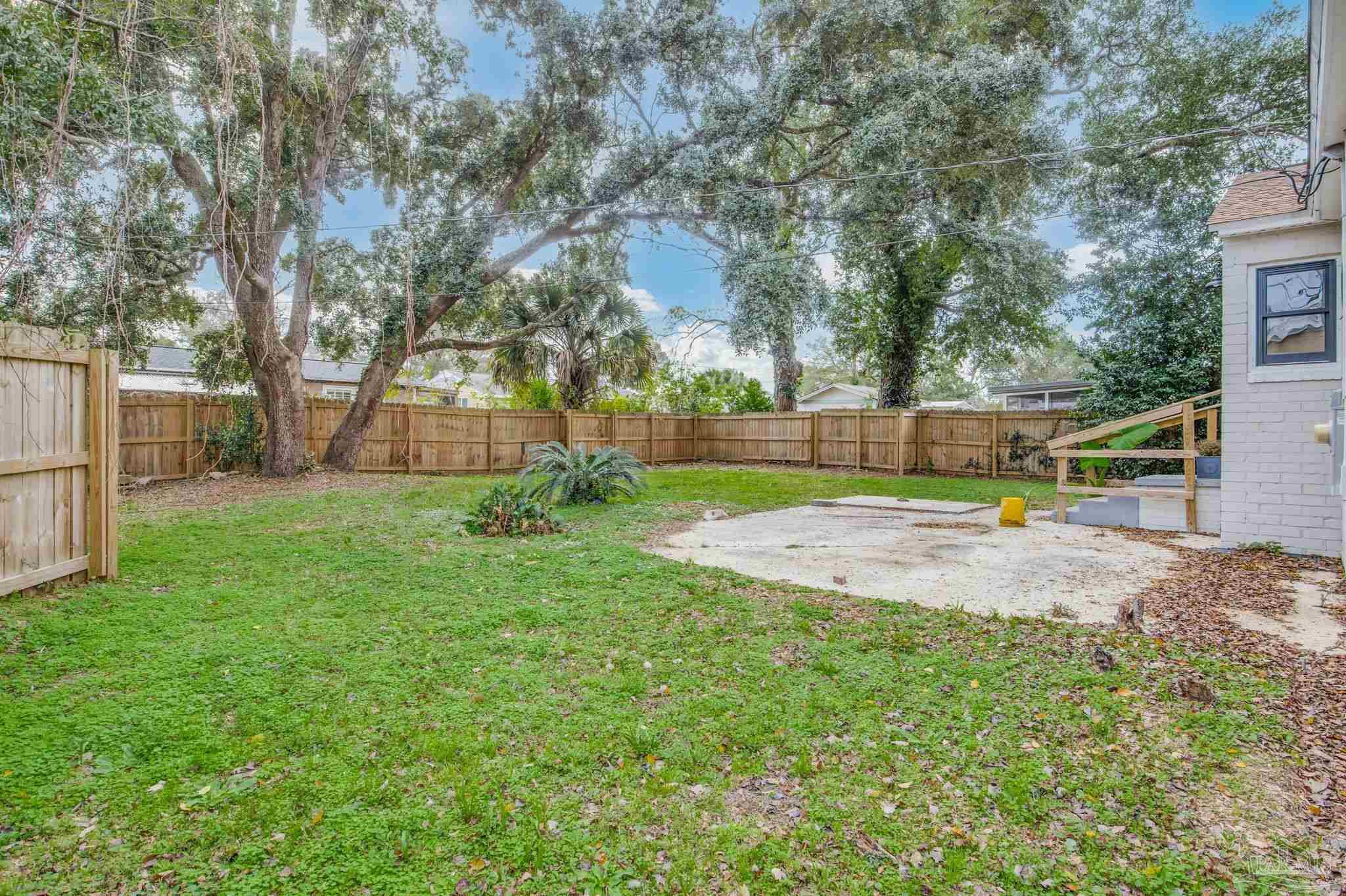 207 Bryant Road Pensacola, FL 32507 - Photo 3 of 23 a view of a backyard with tree s