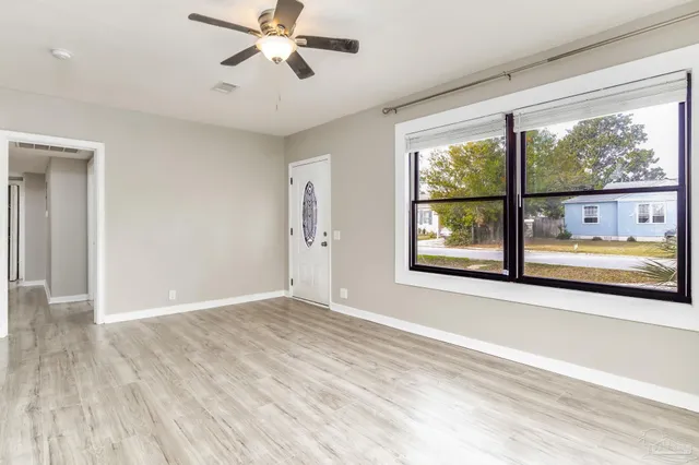 a view of an empty room with a window