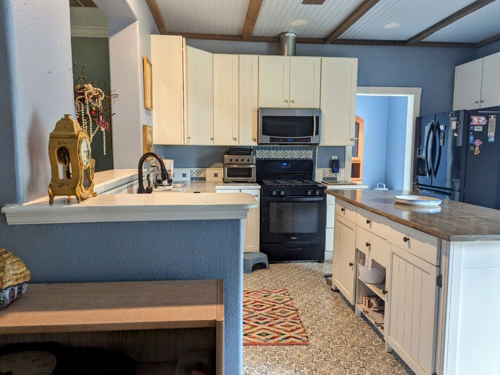 795 Geiger Road Amelia Island, FL 32034 - Photo 6 of 17 a kitchen with a sink appliances and cabinets