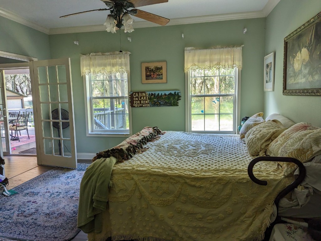 795 Geiger Road Amelia Island, FL 32034 - Photo 8 of 17 a bed sitting in a bedroom next to a window