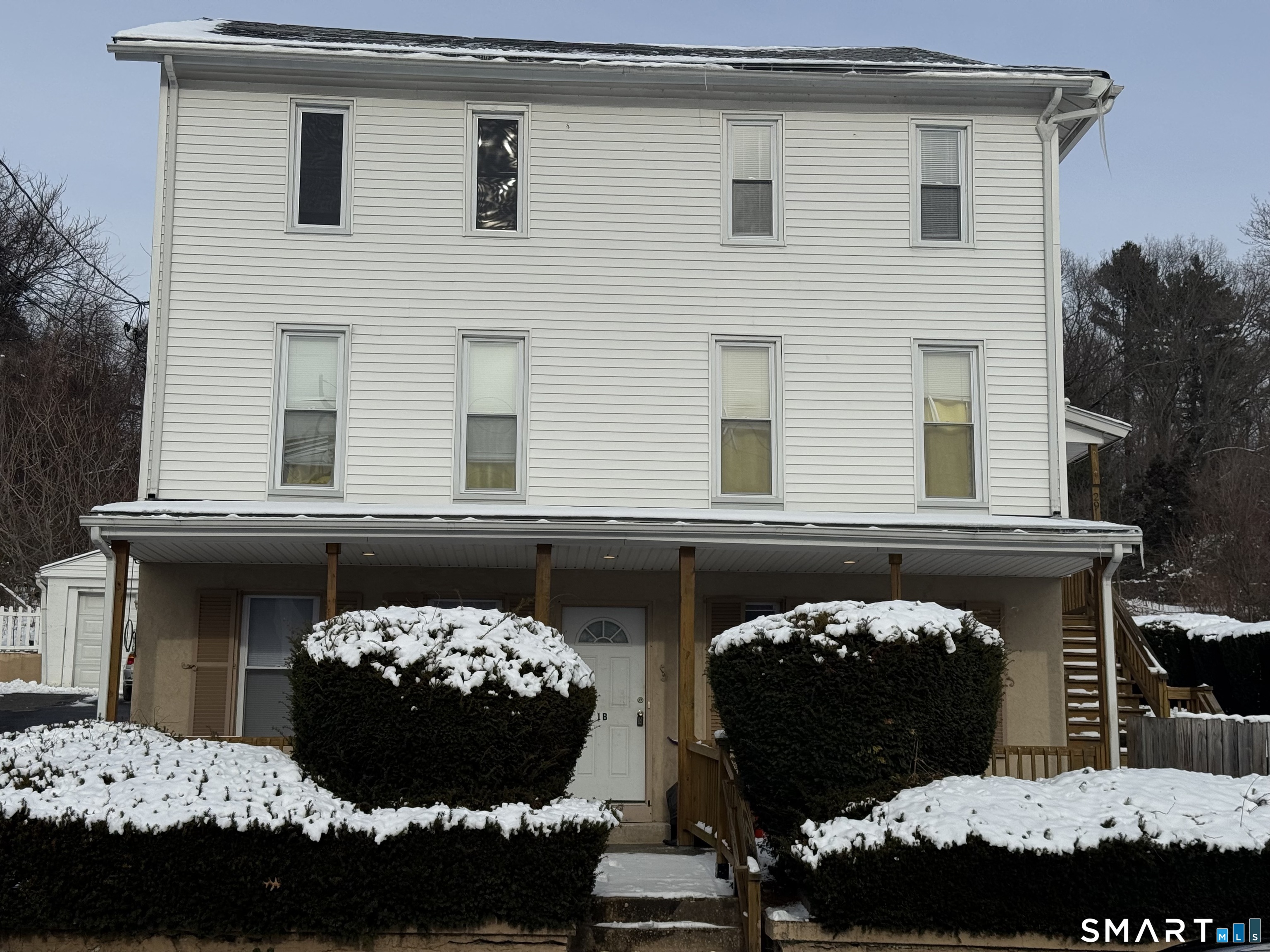 29 Moulthrop Street, Unit 1 Ansonia, CT 06401 - Photo 1 of 11 a front view of a house with a garden