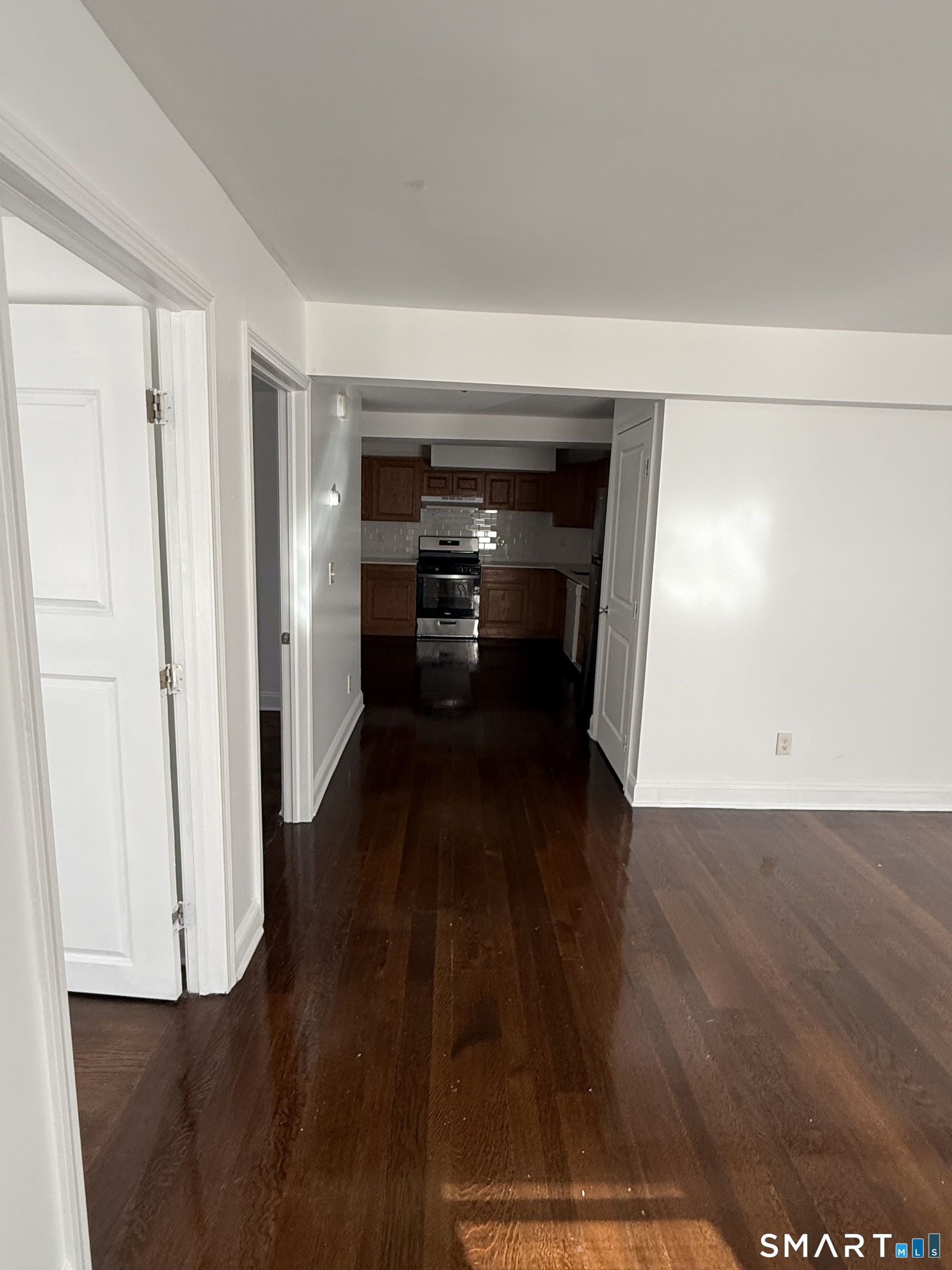 29 Moulthrop Street, Unit 1 Ansonia, CT 06401 - Photo 4 of 11 a view of a hallway with wooden floor