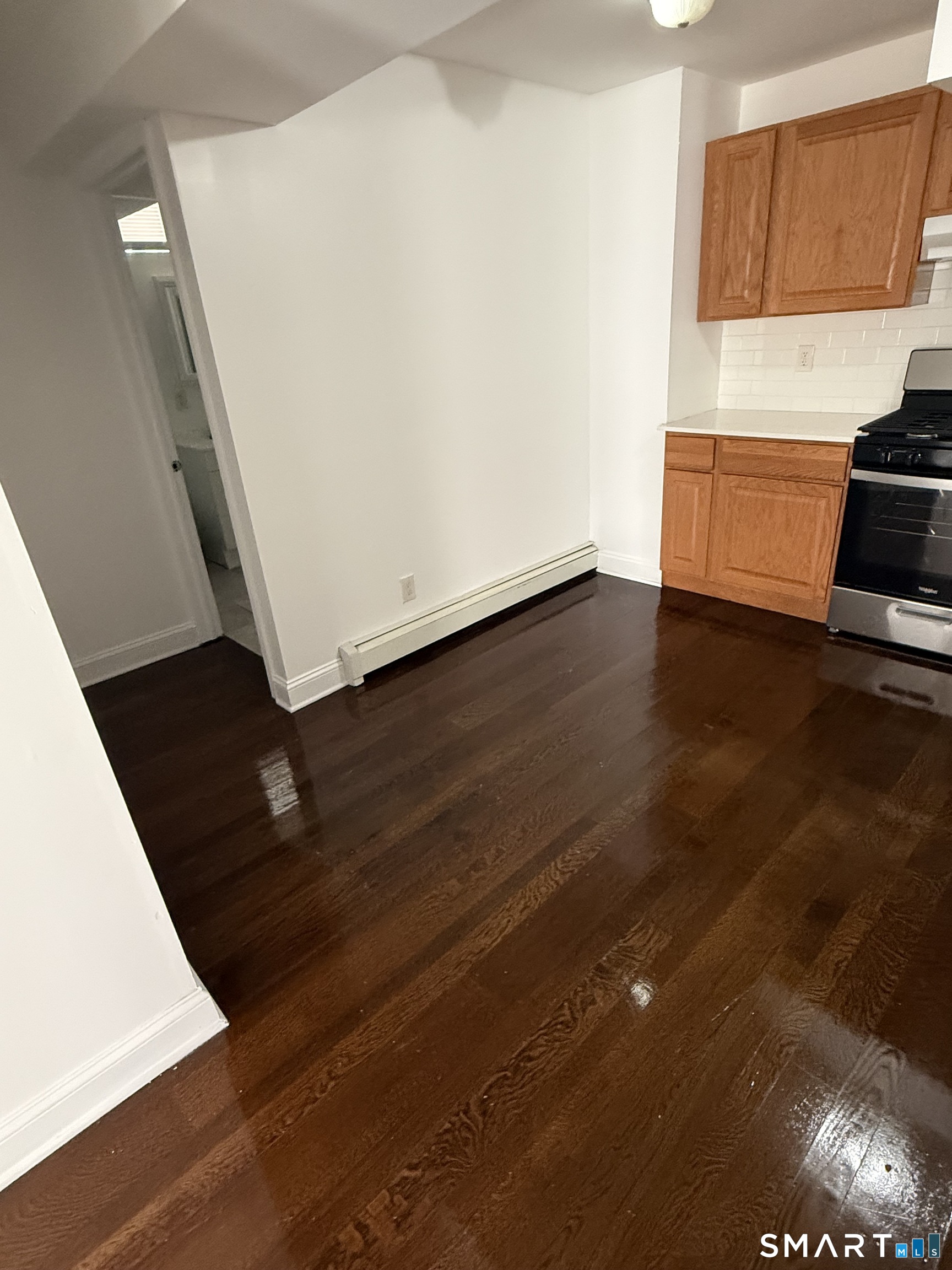 29 Moulthrop Street, Unit 1 Ansonia, CT 06401 - Photo 6 of 11 an empty room with wooden floor