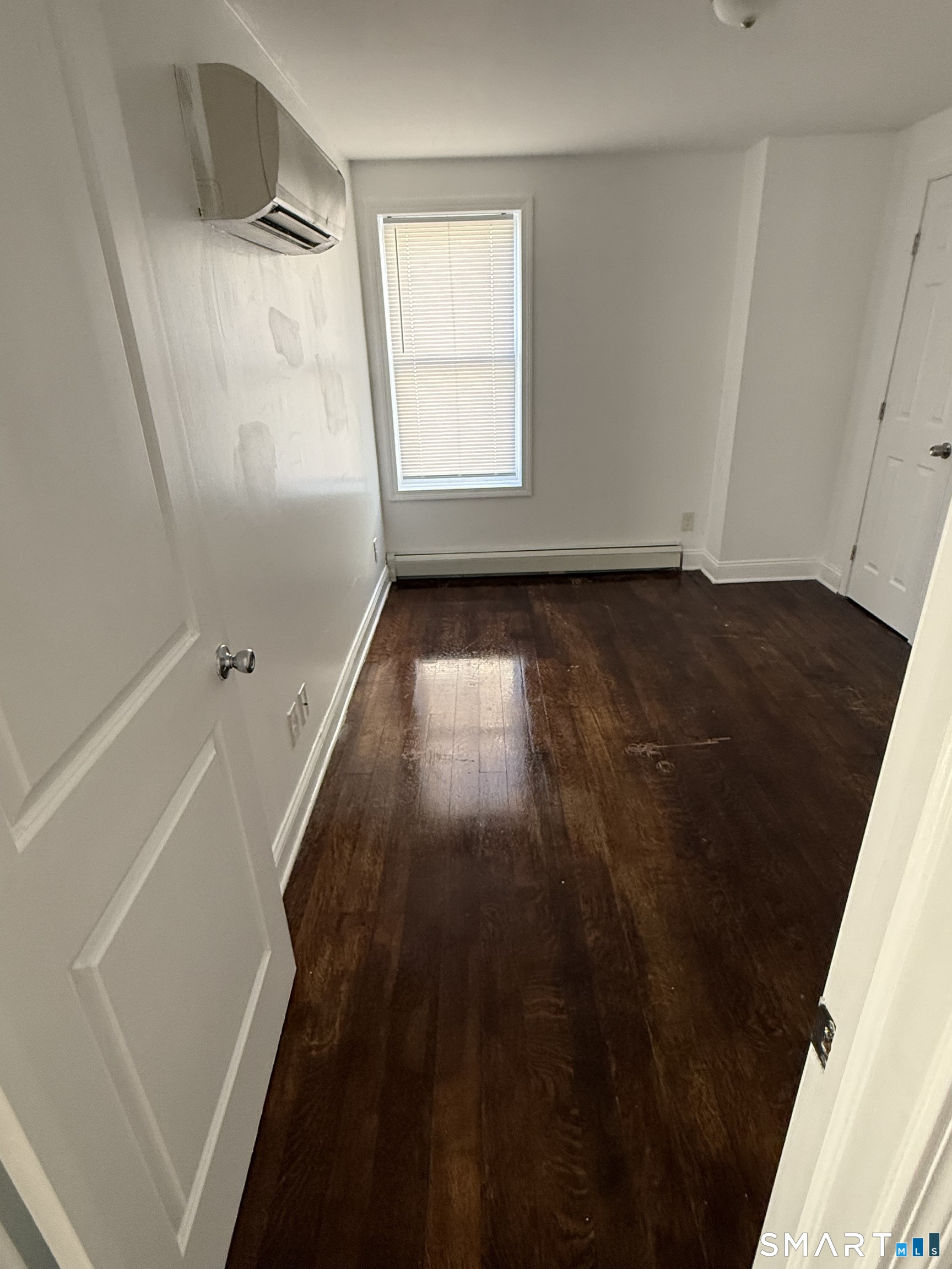 29 Moulthrop Street, Unit 1 Ansonia, CT 06401 - Photo 7 of 11 wooden floor in an empty room with a window