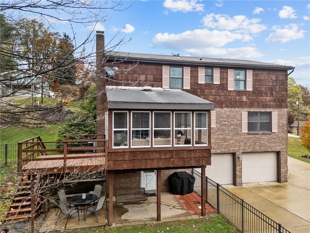 2924 Arrowhead Court Export, PA 15632 - Photo 2 of 37 a balcony with furniture and a potted plant