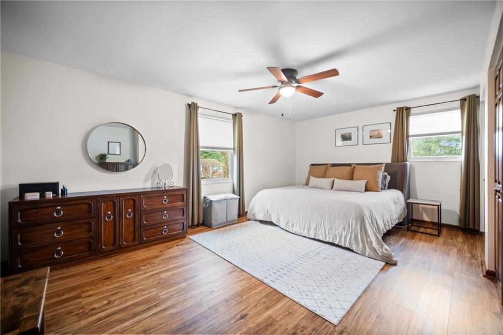 2924 Arrowhead Court Export, PA 15632 - Photo 24 of 37 a bedroom with a bed a dresser and a large mirror