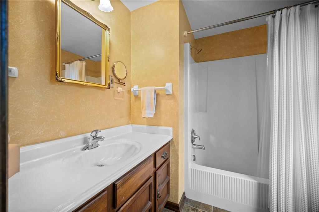 2924 Arrowhead Court Export, PA 15632 - Photo 26 of 37 a bathroom with a sink and a mirror