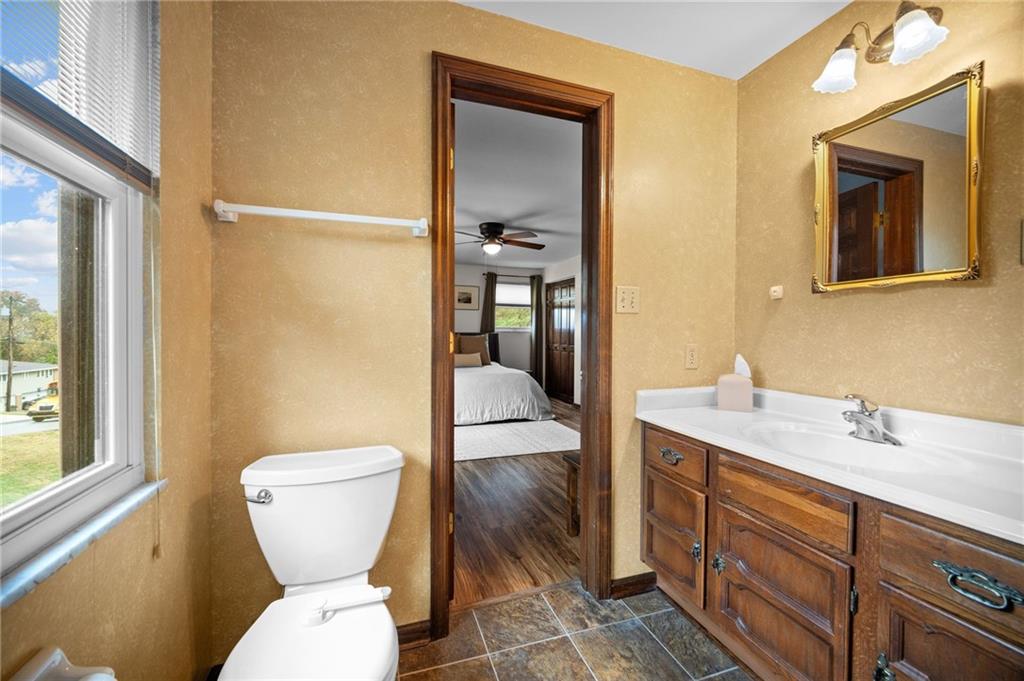 2924 Arrowhead Court Export, PA 15632 - Photo 27 of 37 a bathroom with a toilet sink and mirror