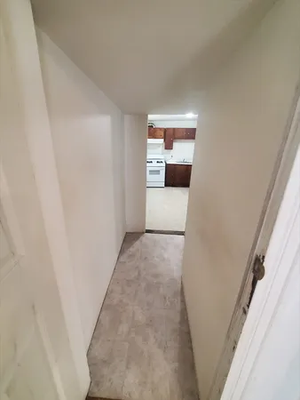 a hallway with storage and utility