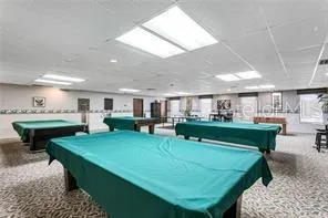 a view of a swimming pool with a yard