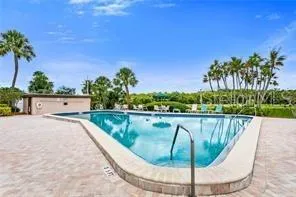 a view of swimming pool with a seating space