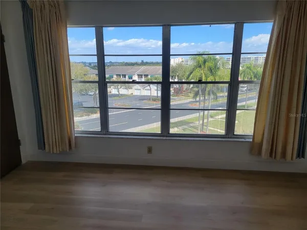 a view of an empty room with a window