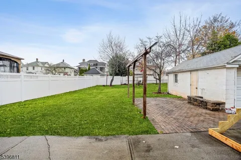 a view of a backyard with a garden and plants