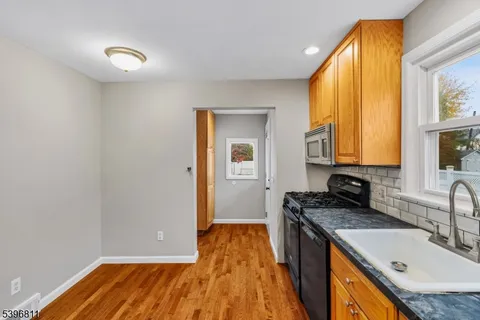 a kitchen with a sink and a window