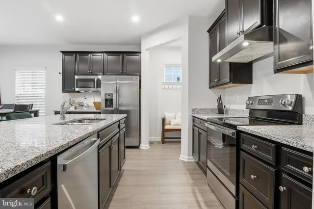 a bathroom with a toilet a sink and a mirror