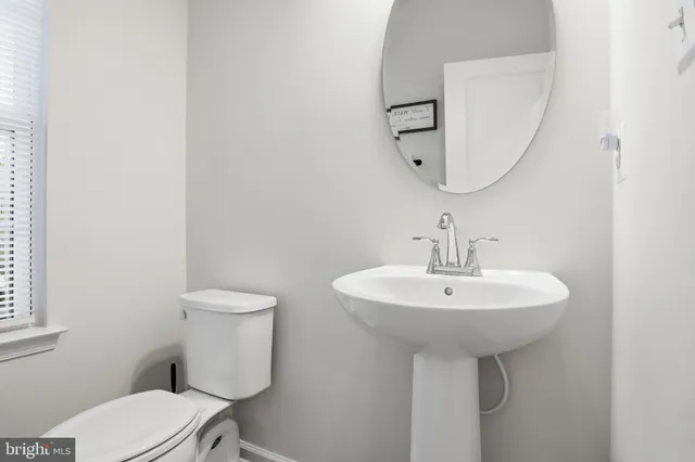 a bedroom with a bed and a chair