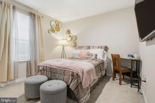 a workspace with furniture hardwood and a window