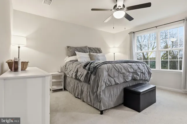 a bed room with a bed and a chandelier