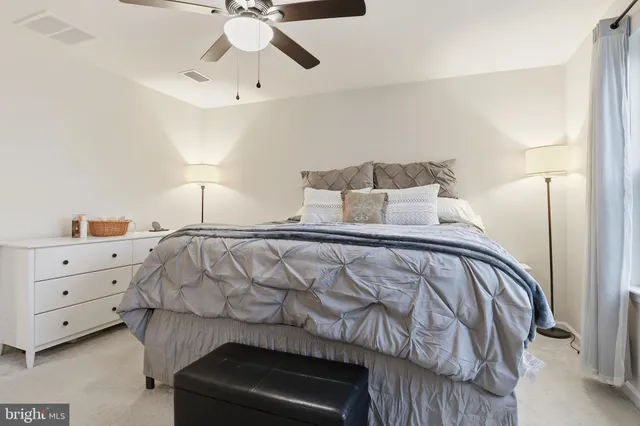 a bathroom with a double vanity sink toilet and a mirror