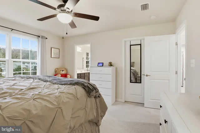 a bathroom with a double vanity sink and mirror