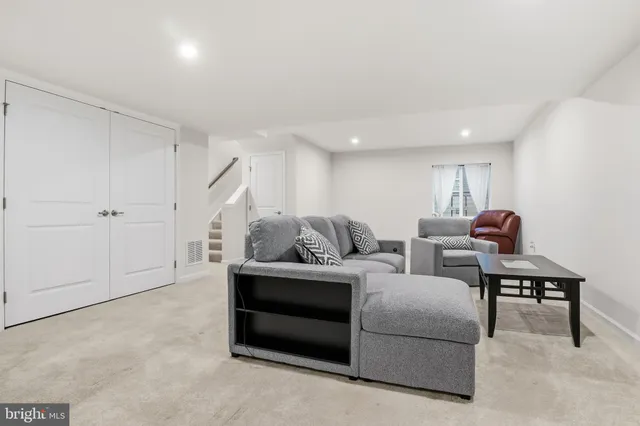 a front view of house with yard and outdoor seating