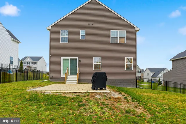 a view of a backyard with large trees