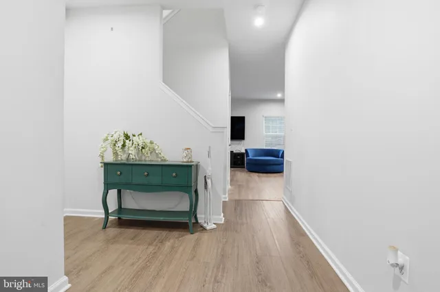 an empty room with wooden floor