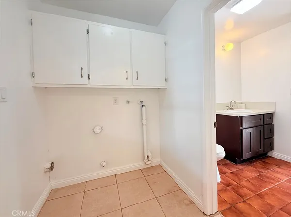 a view of a kitchen with cabinets