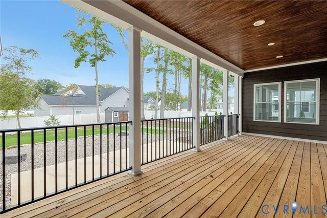 a view of balcony with wooden floor