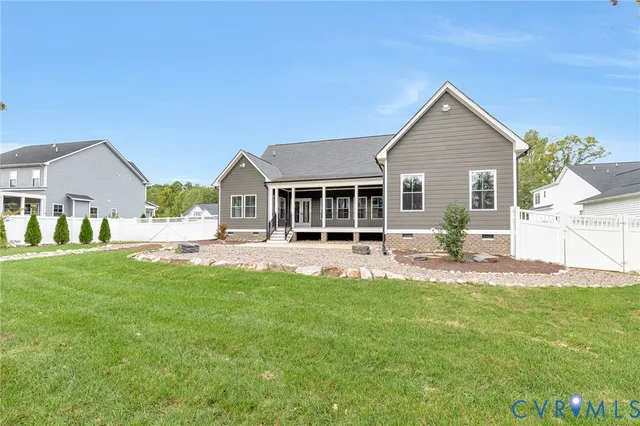 a front view of a house with a yard and porch