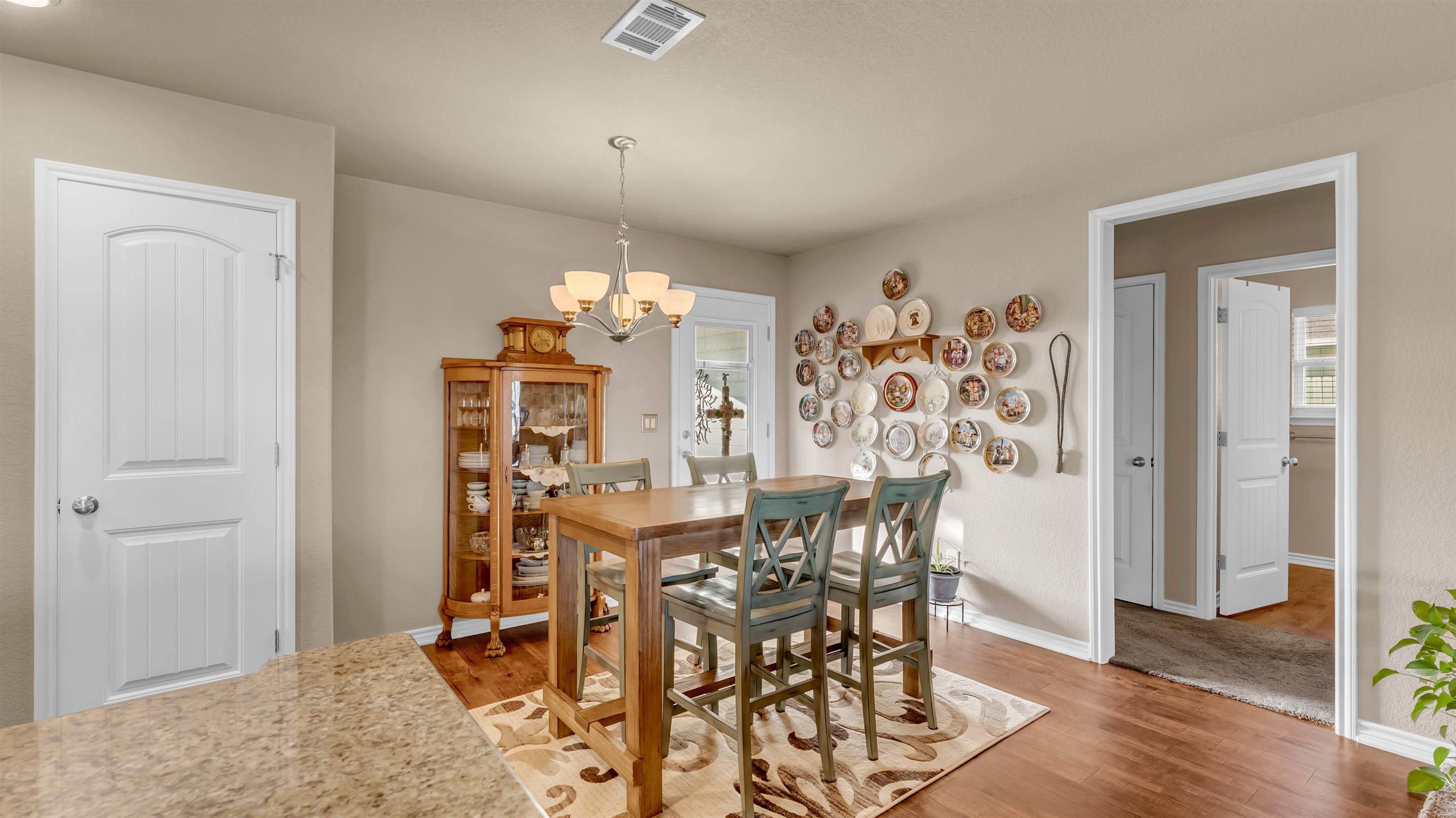 140 Rylee Road Burnet, TX 78611 - Photo 11 of 23 a view of a dining room with furniture and wooden floor