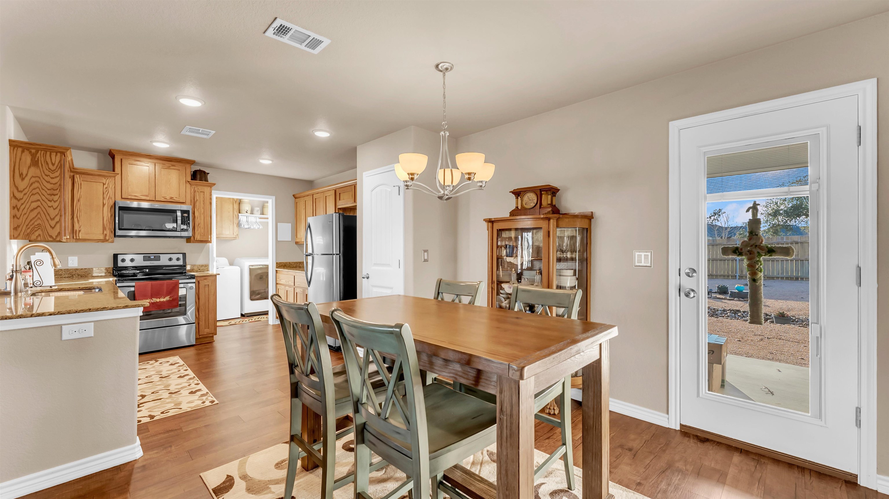 140 Rylee Road Burnet, TX 78611 - Photo 13 of 23 a view of a dining room with furniture window and wooden floor