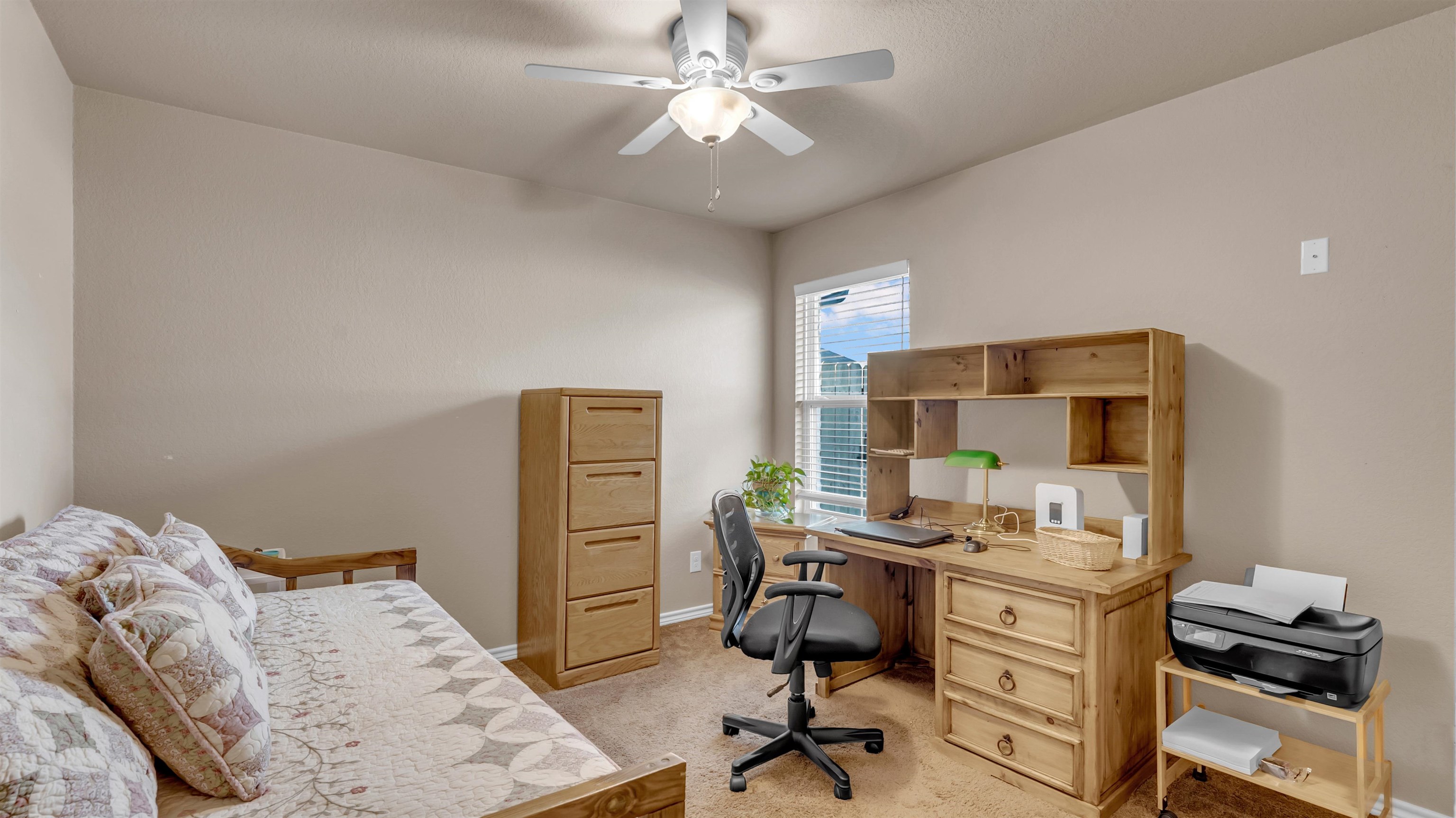 140 Rylee Road Burnet, TX 78611 - Photo 16 of 23 a view of a workspace with furniture and a window