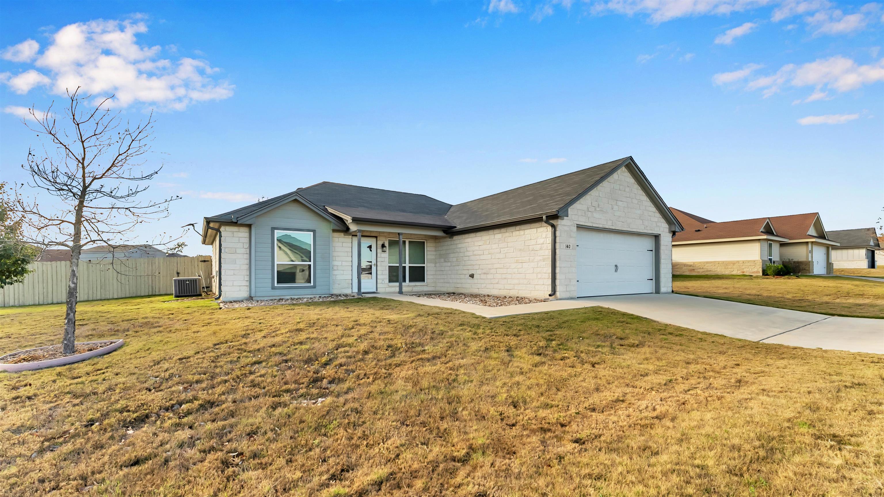 140 Rylee Road Burnet, TX 78611 - Photo 3 of 23 a front view of house with yard