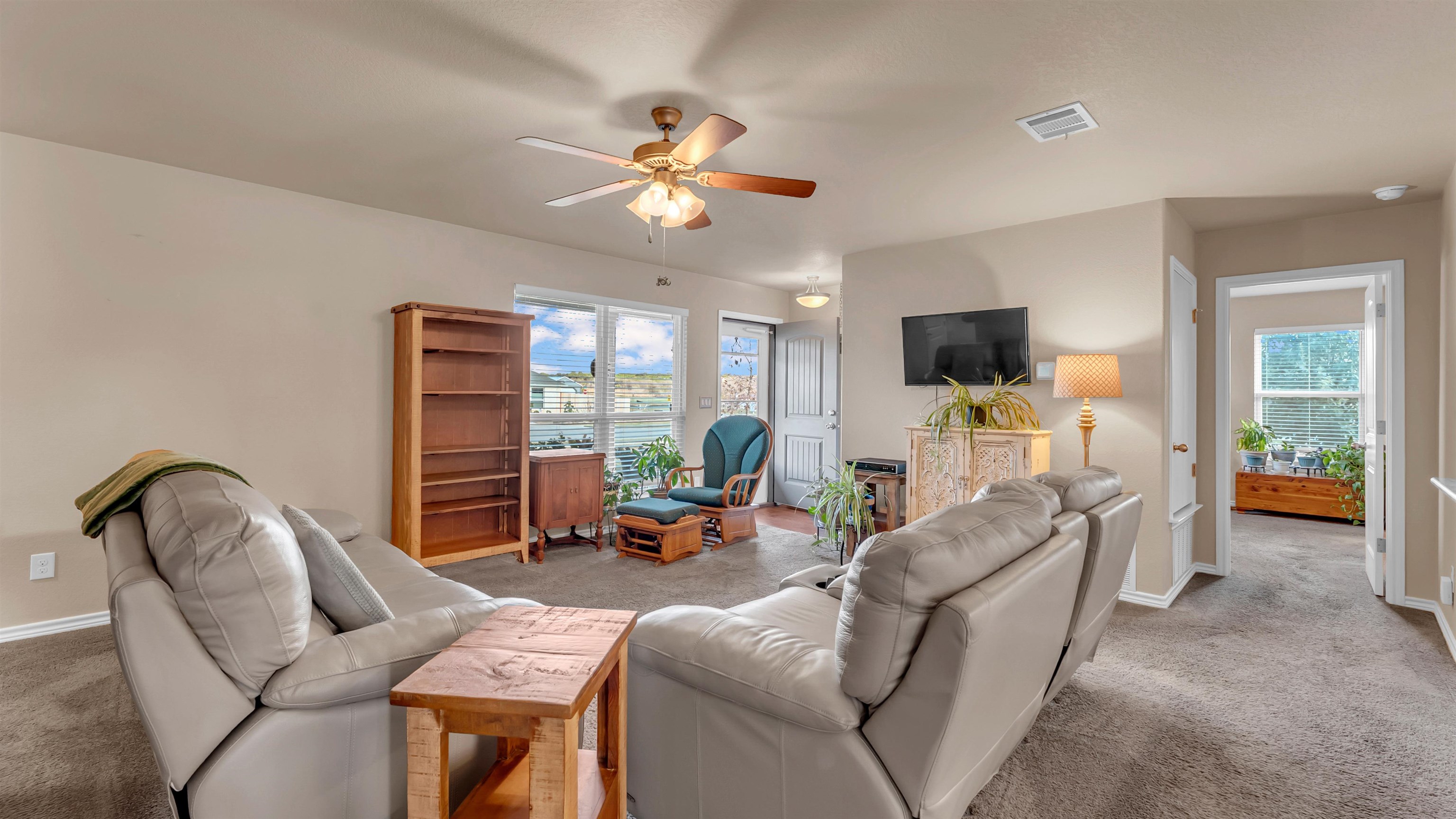 140 Rylee Road Burnet, TX 78611 - Photo 7 of 23 a living room with furniture and a flat screen tv