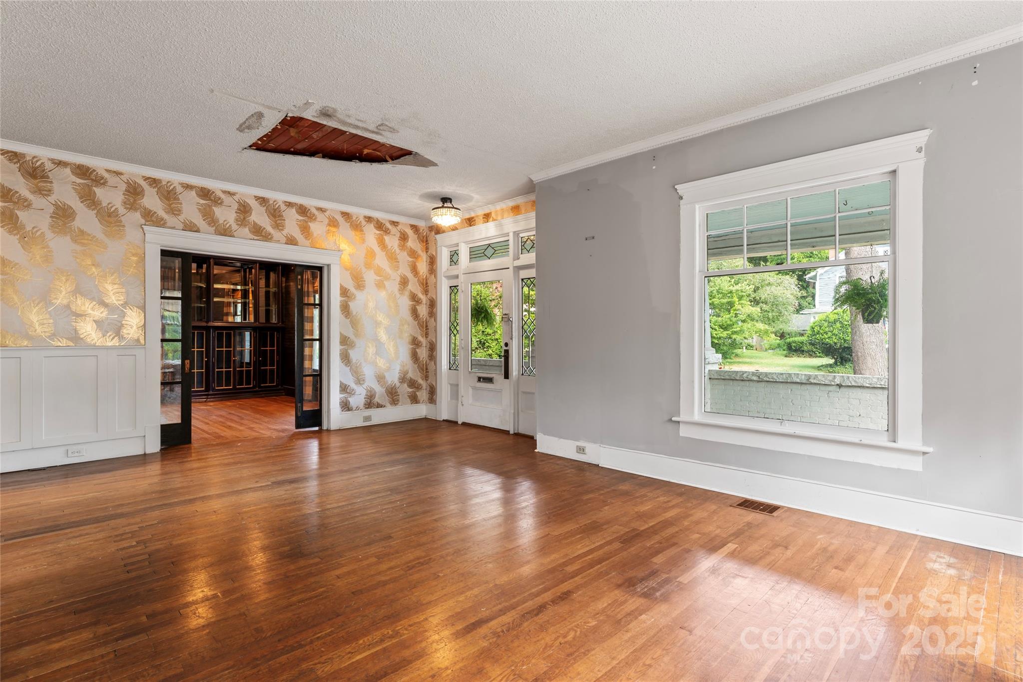 701 South Fulton Street Salisbury, NC 28144 - Photo 5 of 21 a view of an empty room with wooden floor and a window