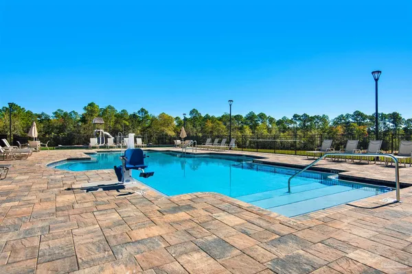 a view of swimming pool with chairs