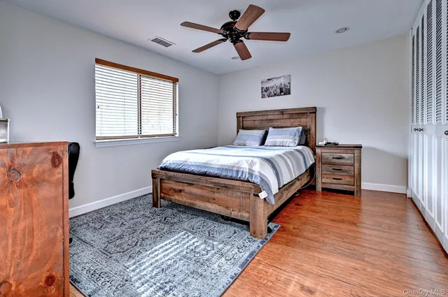 a bed room with a bed and a window