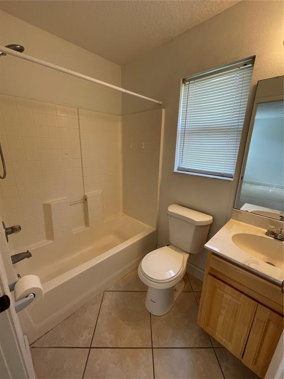 61 Buttonworth Drive, Unit A Palm Coast, FL 32137 - Photo 4 of 10 a bathroom with a sink toilet and shower