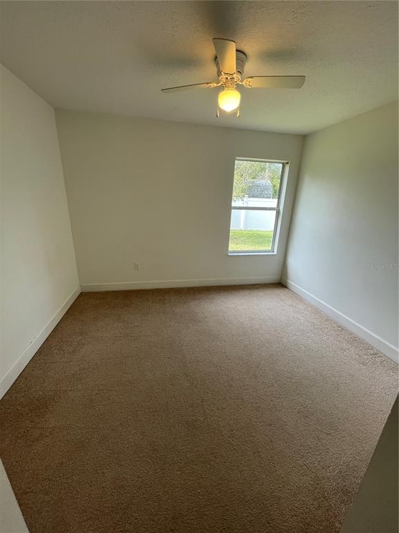 61 Buttonworth Drive, Unit A Palm Coast, FL 32137 - Photo 7 of 10 an empty room with a window