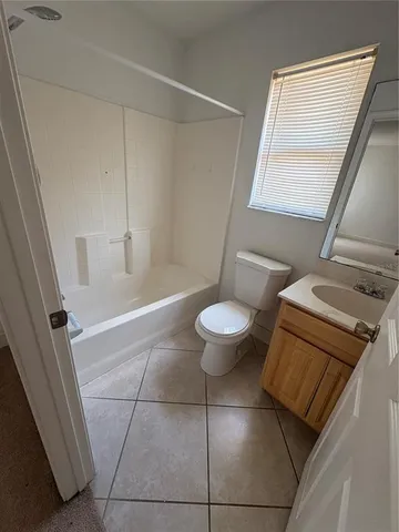 a view of bathroom with a sink and mirror