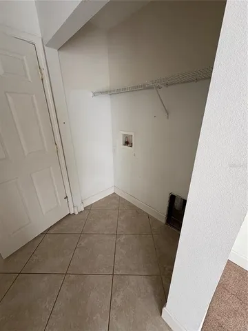 a view of an empty walk in closet